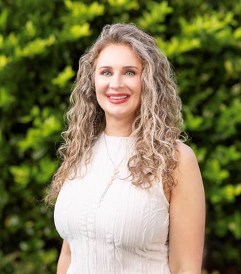 Portrait of Ashley Phelps, Client Services Director